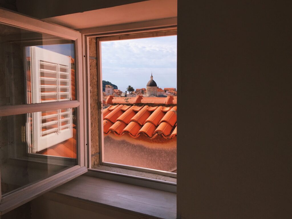View through the open window of old European town